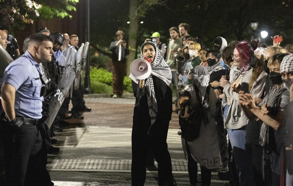 Pro-Palestinian protesters and Philadelphia police have a standoff along 34th Street at the University of Pennsylvania on Friday, May 17, 2024. Authorities say a half-dozen University of Pennsylvania students were among 19 pro-Palestinian protesters arrested during an attempt to occupy a building on campus. University police say seven remained in custody Saturday awaiting felony charges from Friday's incident, including one person who allegedly assaulted an officer. (Charles Fox/The Philadelphia Inquirer via AP)