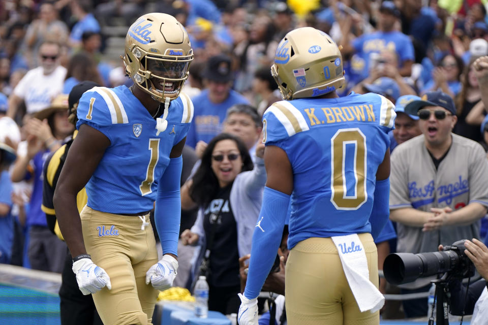 UCLA wide receiver J. Michael Sturdivant, left, celebrates with wide receiver Kam Brown after Brown scored a touchdown during the first half of an NCAA college football game against North Carolina Central Saturday, Sept. 16, 2023, in Pasadena, Calif. (AP Photo/Mark J. Terrill)