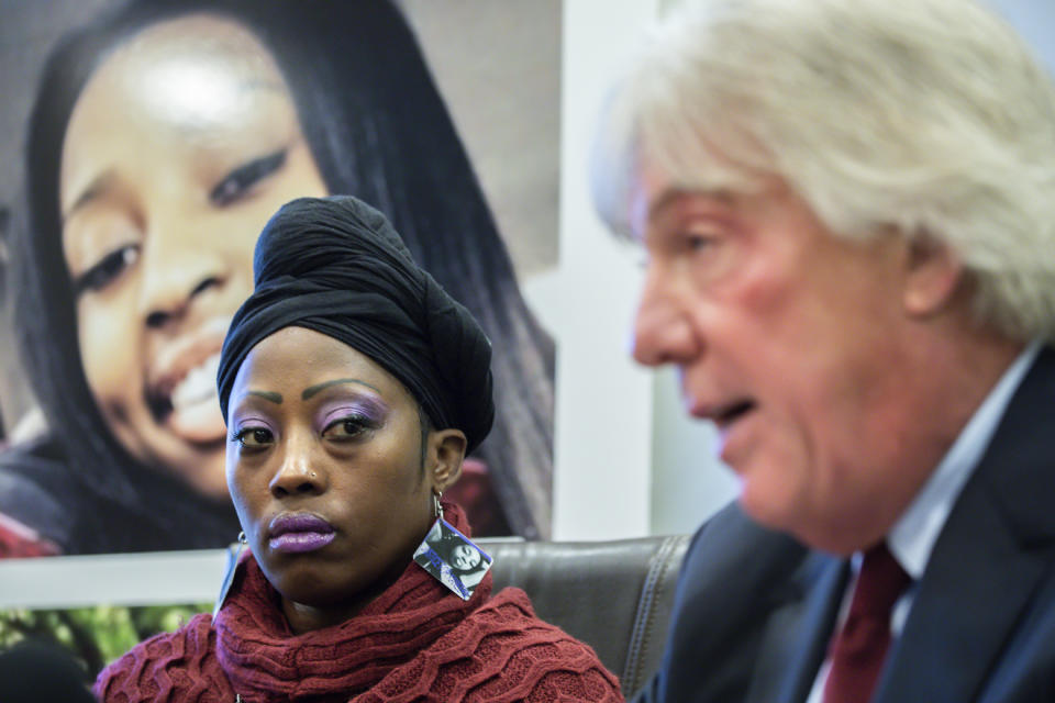 Attorney Geoffrey Fieger, right, and Tereasa Martin, left, mother of Kenneka Jenkins show evidence pictures as they talk about lawsuit against the Crowne Plaza hotel at a press conference in Chicago on Tuesday, Dec.18, 2018. Fieger represents the family of Jenkins who was found dead in a walk-in freezer. (Zbigniew Bzdak/Chicago Tribune via AP)