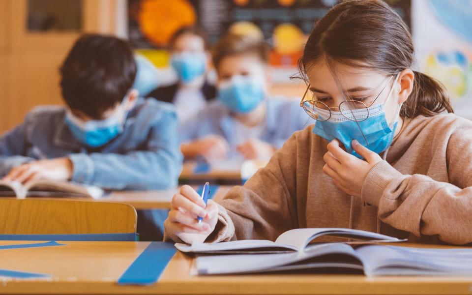 Children in classroom wearing masks