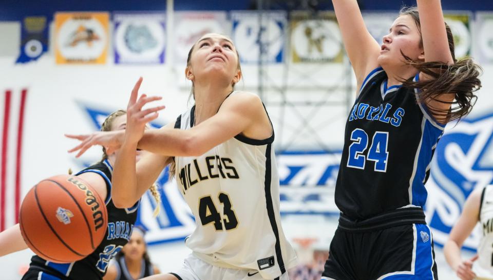 Noblesville Millers forward C.C. Quigley (43) loses control of the ball against Hamilton Southeastern Royals Addi Van Hoesen (24) on Saturday, Feb. 3, 2024, during the IHSAA girls basketball sectional Class 4A game at Hamilton Southeastern High School in Indianapolis. The Noblesville Millers defeated the Hamilton Southeastern Royals, 49-45.