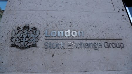 Signage is seen outside the entrance of the London Stock Exchange in London