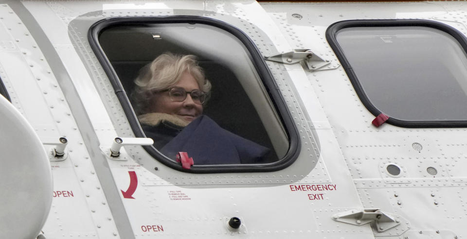 FILE - German Defence Minister Christine Lambrecht sits in a helicopter as she arrives for the presentation of the Marder armored personnel carrier at the 'Erzgebirgskaserne' barracks in Marienberg, eastern Germany, Thursday, Jan. 12, 2023. Defense Minister Christine Lambrecht resigns. She has asked Chancellor Olaf Scholz to dismiss her, said a statement from the minister. (AP Photo/Michael Sohn, File)