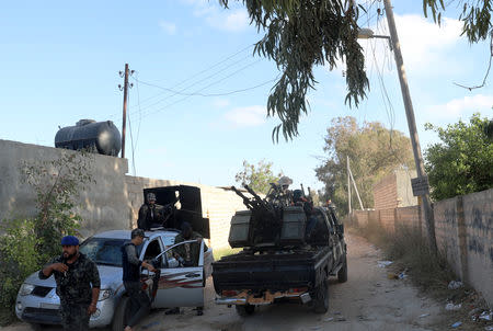 Members of the Libyan internationally recognised government forces gather during a fight with Eastern forces in Ain Zara, Tripoli, Libya April 28, 2019. REUTERS/Ismail Zitouny