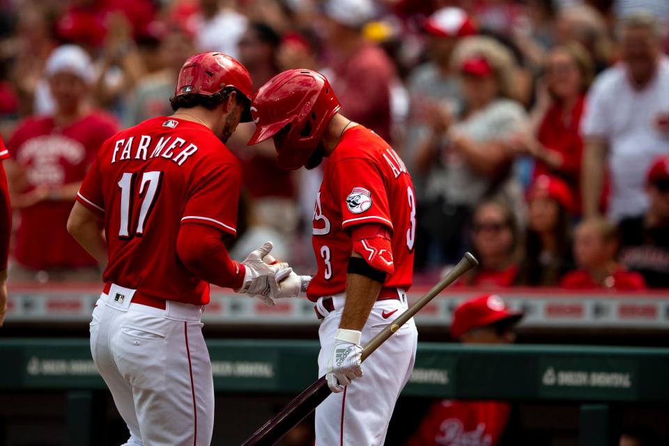 Cincinnati Reds shortstop Kyle Farmer (17) celebrates with Cincinnati Reds left fielder Albert Almora (3) after hitting a 3-run home run in the first inning of the MLB game between the Cincinnati Reds and the San Francisco Giants at Great American Ball Park in Cincinnati, Saturday, May 28, 2022.