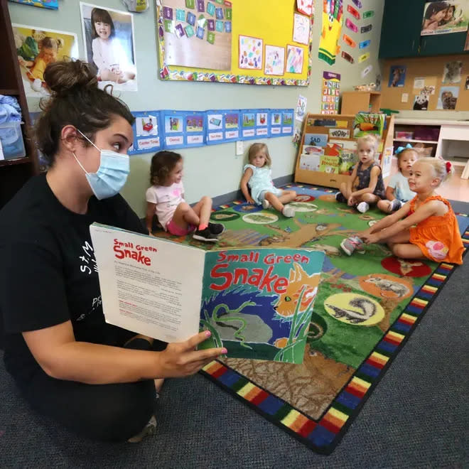 Holly Fraize reads to students at St. Mark's Episcopal Day School, in Venice.