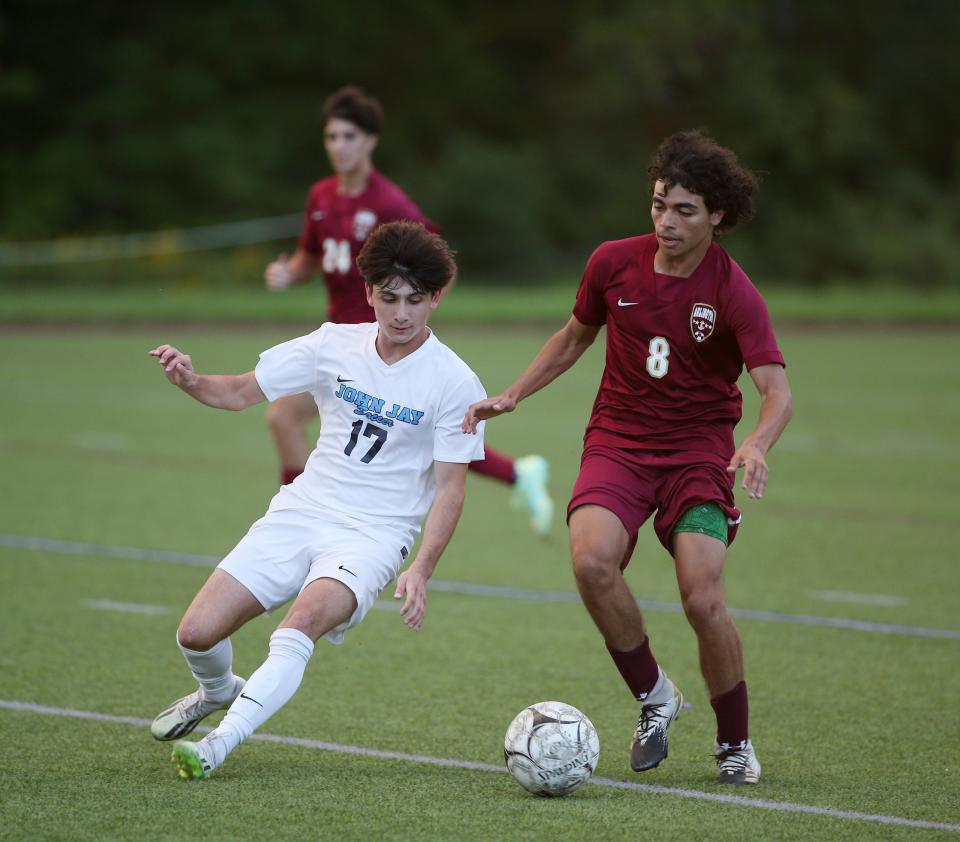 Arlington’s Ihab Elafraoui and John Jay's Louis Rizzi battle for the ball during Wednesday’s game in Freedom Plains on September 13, 2023.