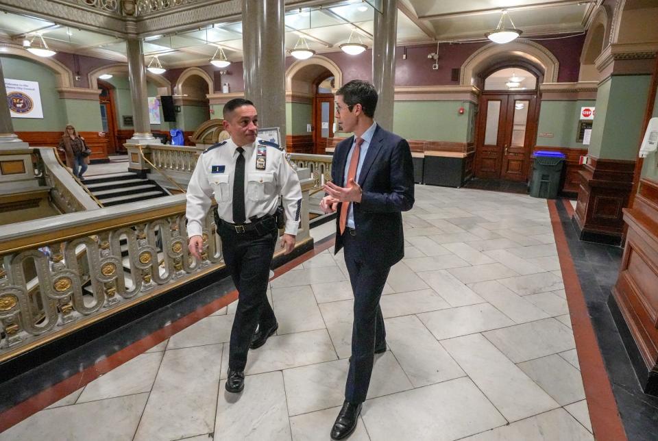 Providence Mayor Brett Smiley, right, in City Hall with Col. Oscar Perez, the chief of police.