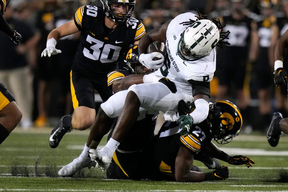 Michigan State tight end Maliq Carr (6) is tackled by Iowa defensive back Jermari Harris (27) after catching a pass during the first half at Kinnick Stadium in Iowa City, Iowa, on Saturday, Sept. 30, 2023.