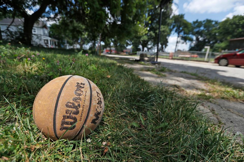 A basketball sits idly on Columbia Ave.,  Monday, Aug. 2, 2021 in the Martindale-Brightwood area. 