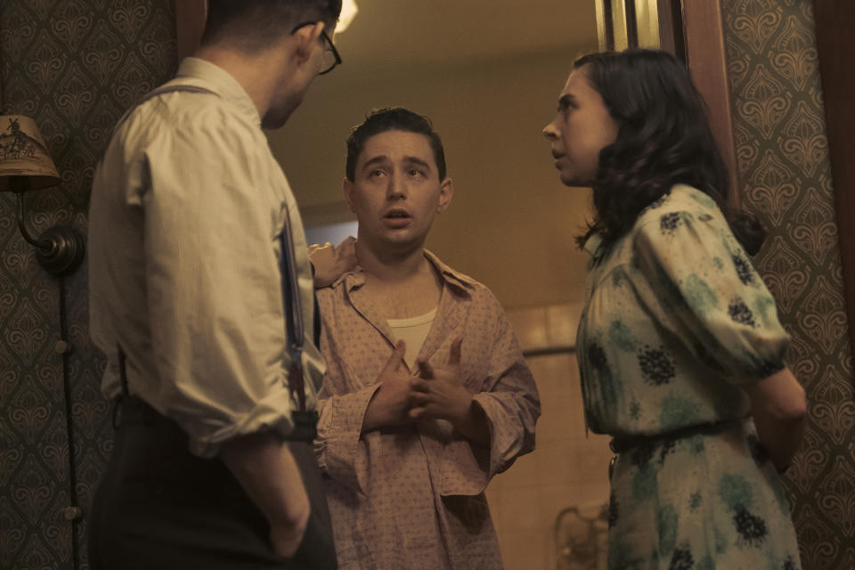 Jan and Miep console Kuno as seen in A SMALL LIGHT. (From left: Joe Cole and Jan Gies, Preston Nyman as Kuno, and Bel Powley as Miep Gies). (Credit: National Geographic for Disney/Dusan Martincek)