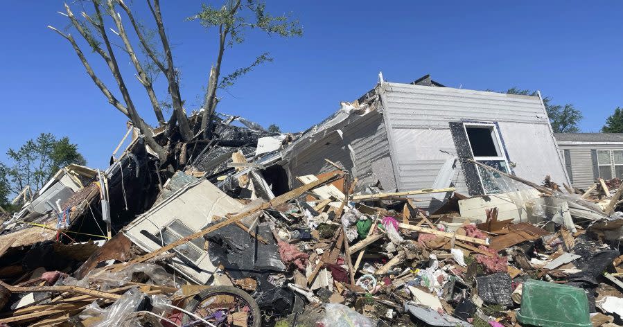 A storm damaged mobile home is surrounded by debris at Pavilion Estates mobile home park just east of Kalamazoo, Mich. Wednesday, May 8, 2024. A tornado ripped through the area the evening of May 7. (AP Photo/Joey Cappelletti)