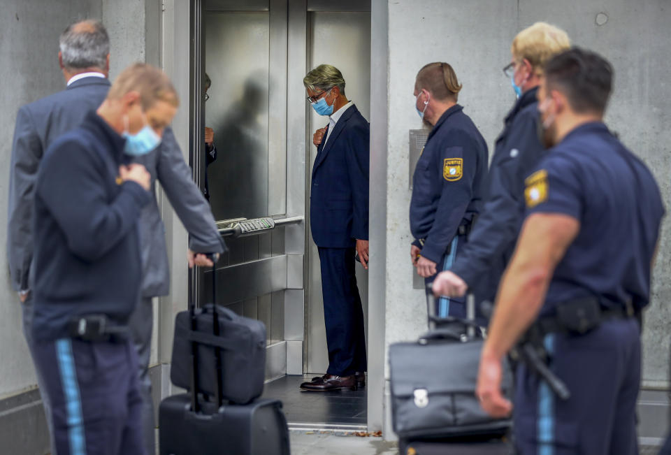 Rupert Stadler, former CEO of German car manufacturer Audi, center, arrives at a district court in Munich, Germany, Wednesday, Sept. 30, 2020. Stadler stands trial in Germany over the "dieselgate" emissions scandal, five years after parent company VW admitted responsibility. (AP Photo/Matthias Schrader)