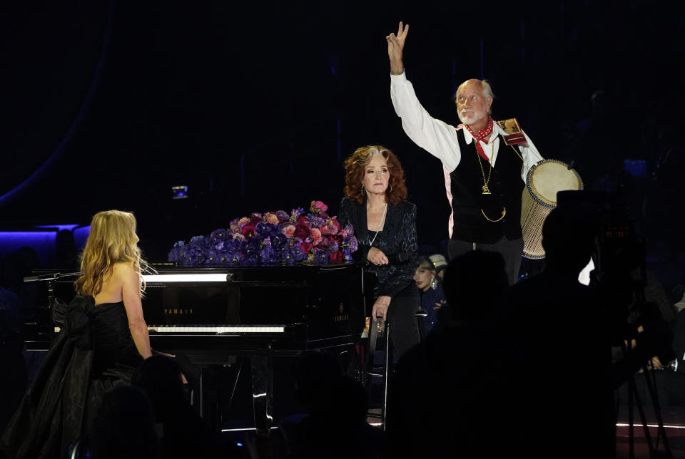 Sheryl Crow, from left, Bonnie Raitt and Mick Fleetwood perform "Songbird" during a tribute to the late singer Christine McVie at the 65th annual Grammy Awards on Sunday, Feb. 5, 2023, in Los Angeles. (AP Photo/Chris Pizzello)