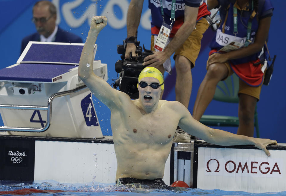 FILE - Australia's Mack Horton celebrates after winning the gold medal after the men's 400-meter freestyle final during the swimming competitions at the 2016 Summer Olympics, Aug. 6, 2016, in Rio de Janeiro. Horton, who had an intense rivalry with China’s Sun Yang, announced his retirement Sunday, Jan 21,2024, from international swimming. (AP Photo/Michael Sohn, File)