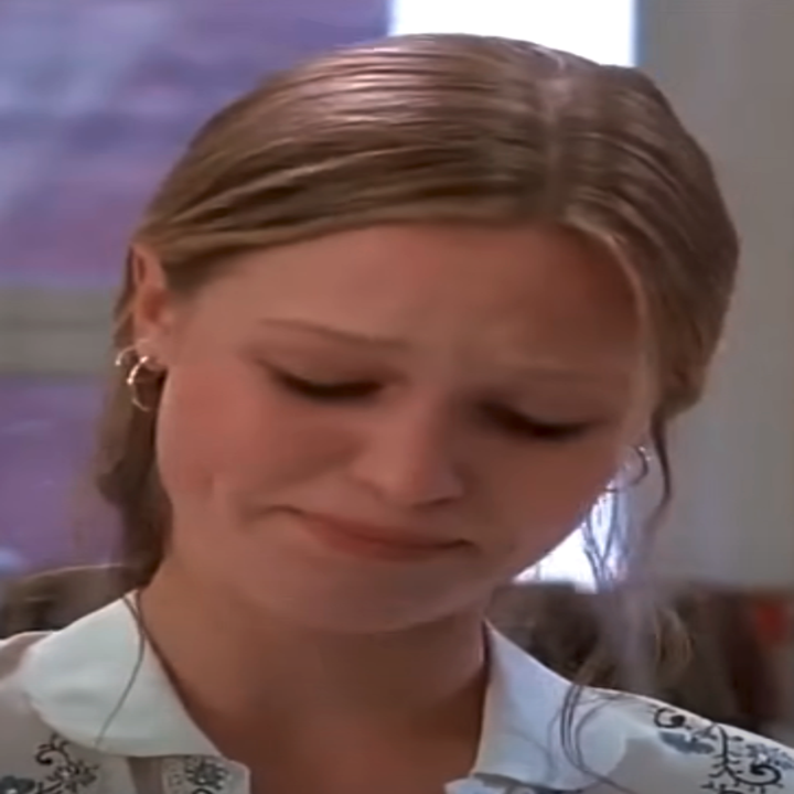 Close-up of Julia in the movie looking down and upset