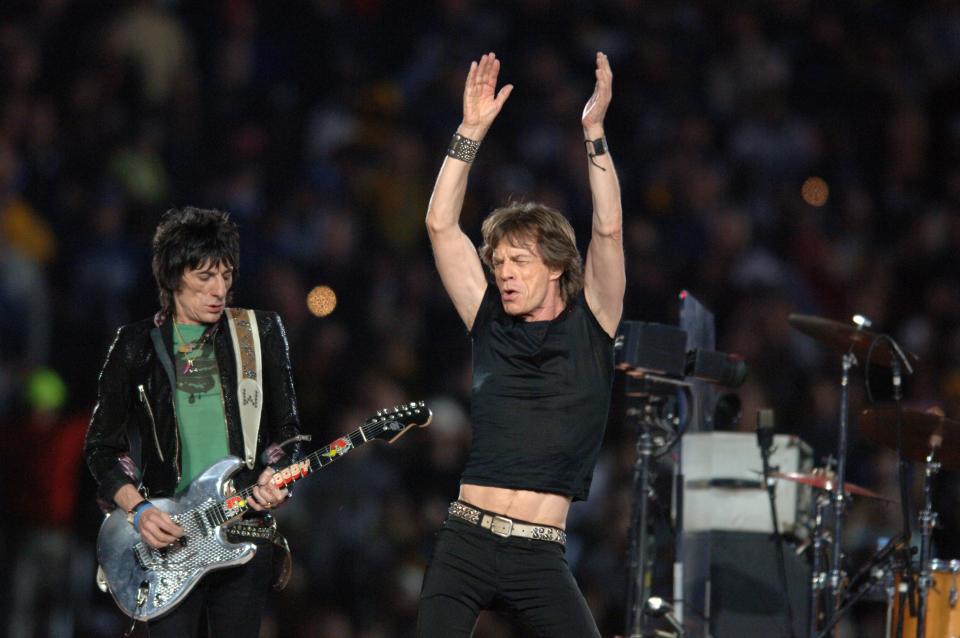 Keith Richards and Ron Wood, left, of the Rolling Stones perform at halftime of Super Bowl XL on Sunday, February 5, 2006, in Detroit, Michigan. (Photo by Lionel Hahn/Abaca Press/Tribune News Service via Getty Images)