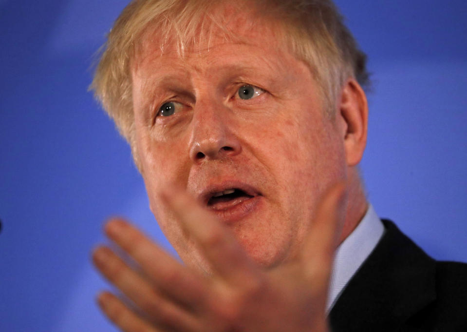 Britain's Conservative Party lawmaker Boris Johnson gestures as he speaks during the official launch of his leadership campaign, in London, Wednesday June 12, 2019. Boris Johnson solidified his front-runner status in the race to become Britain's next prime minister on Tuesday, gaining backing from leading pro-Brexit lawmakers.(AP Photo/Frank Augstein)