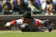 Arizona Diamondbacks' Ketel Marte (4) reacts after fouling a ball off of himself during the first inning of a baseball game against the Chicago Cubs Saturday, Sept. 9, 2023, in Chicago. (AP Photo/Paul Beaty)