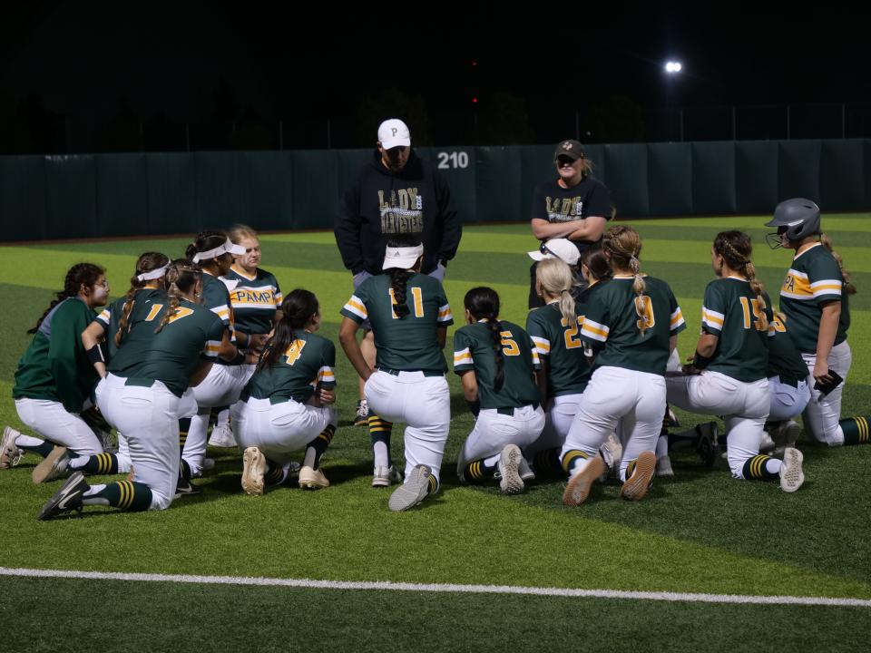 The Pampa softball team gathers around after their 12 inning game against Burkburnett on Friday, May 19, 2023 at Lubbock Christian University.