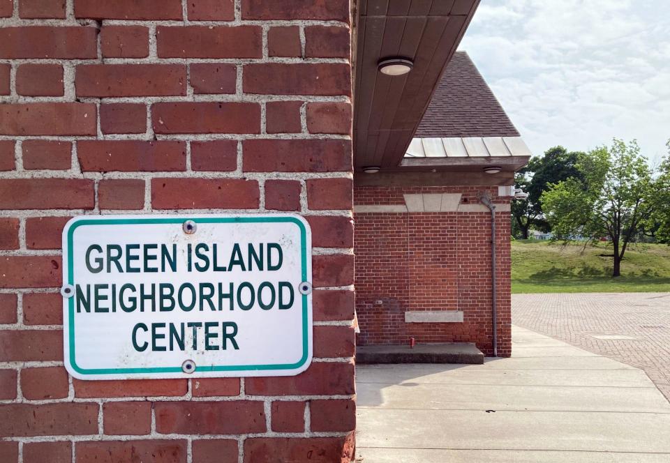 The community center in the Green Island neighborhood is surrounded by a few trees and some grass — but mostly lots and lots of concrete. The area suffers from heat island effects.