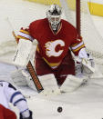 CALGARY, CANADA - MARCH 9: Miikka Kiprusoff #34 of the Calgary Flames defends against one of 45 shots taken against him during NHL action against the Winnipeg Jets on March 9, 2012 at the Scotiabank Saddledome in Calgary, Alberta, Canada. (Photo by Mike Ridewood/Getty Images)