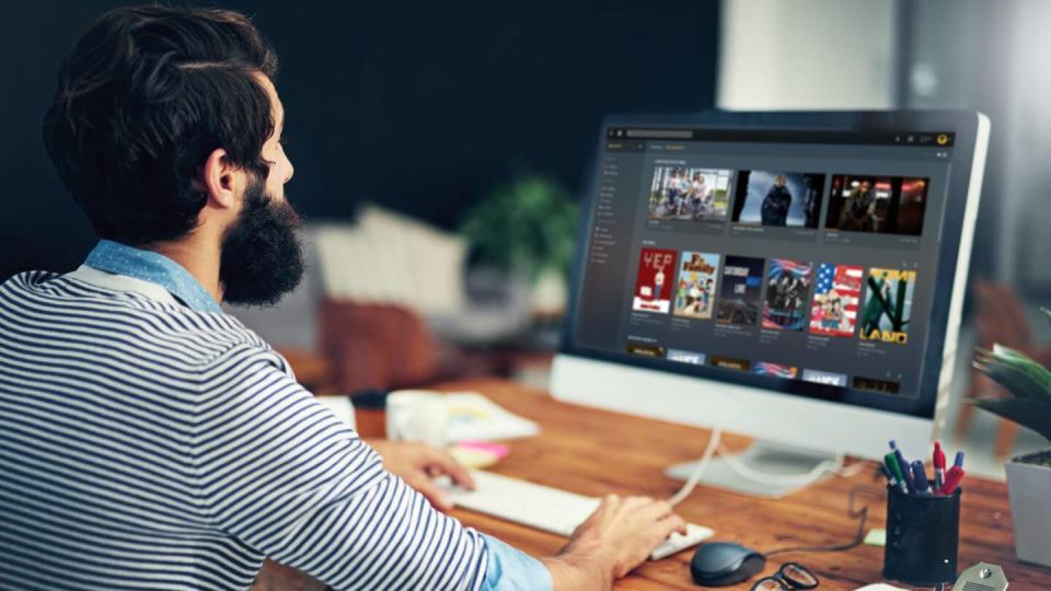 A man browses a Plex media server