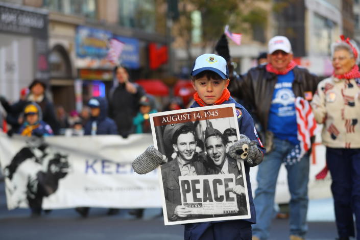 <p>A young marchers holds up a sign saying “Peace” during the Veterans Day parade on Fifth Avenue in New York on Nov. 11, 2017. (Photo: Gordon Donovan/Yahoo News) </p>