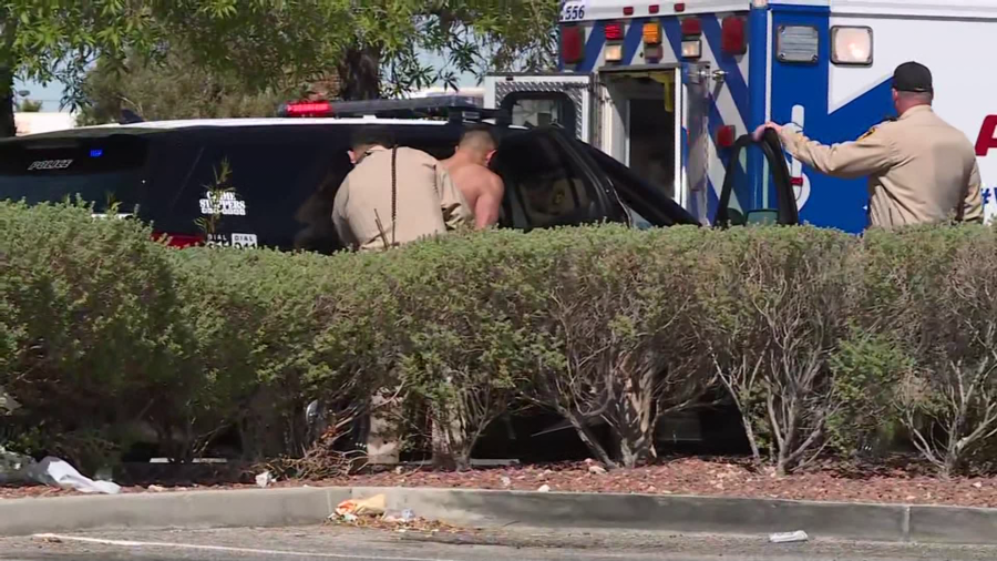 Las Vegas police take man into custody as they investigate shooting near Flamingo Road and 215 on Wednesday, May 1, 2024 (KLAS)