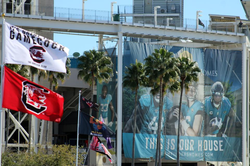 South Carolina Gamecocks flags fly outside TIAA Bank Field before the TaxSlayer Gator Bowl college football game against Notre Dame in Jacksonville on December 30, 2022.