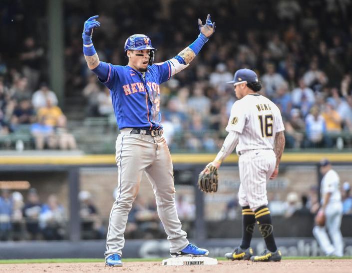 New York Mets shortstop Javier Baez reacts after hitting a double to drive in two runs in the fourth inning against the Milwaukee Brewers at American Family Field, Sept. 26, 2021 in Milwaukee.