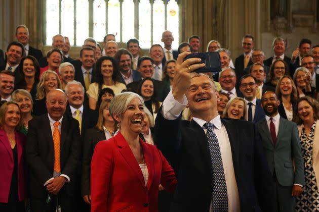 Ed Davey and deputy Lib Dem leader Daisy Cooper with their 72 MPs.