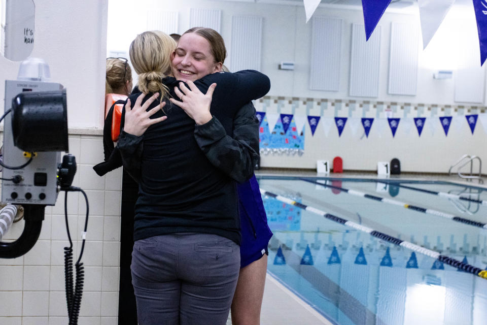 Kseniia Luniushina embraces East Stroudsburg South head coach Sam Munford on her senior day.