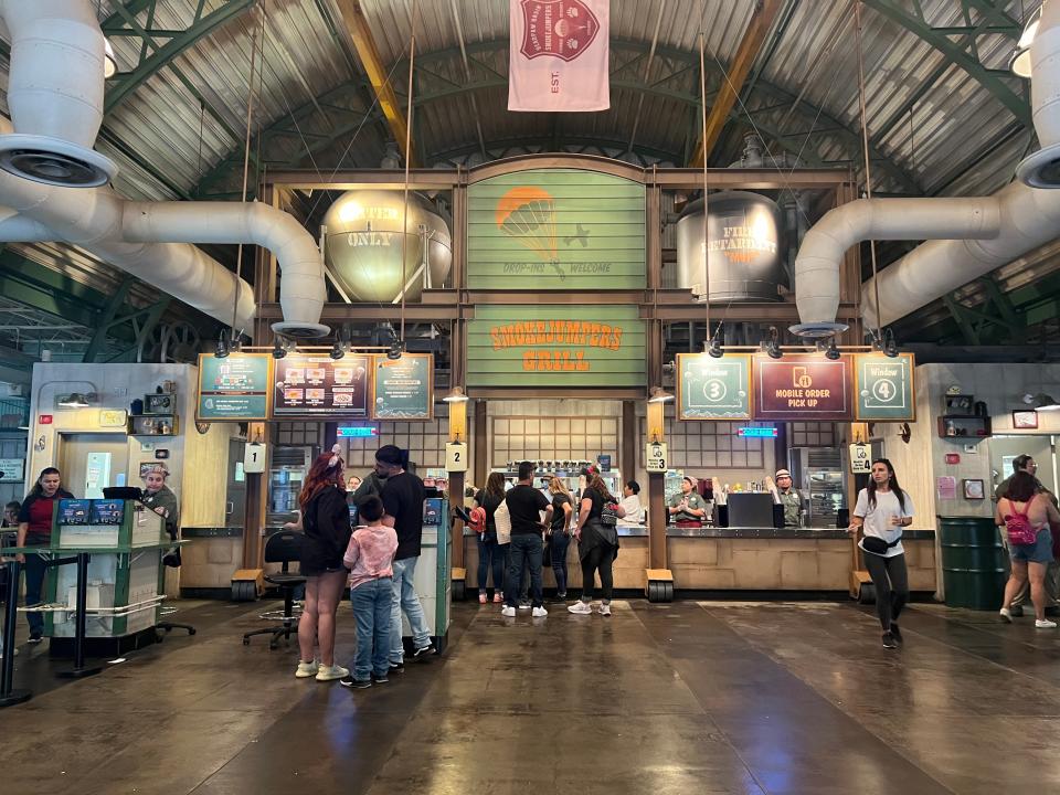 people standing in a food line at disneyland