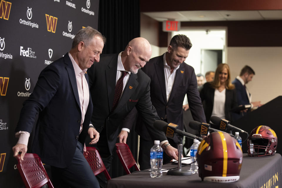 Washington Commanders new head coach Dan Quinn, second from left, Commanders managing partner Josh Harris, left, and general manager Adam Peters, third from left, take their seats for an NFL football news conference at Commanders Park in Ashburn, Va., Monday, Feb. 5, 2024. (AP Photo/Manuel Balce Ceneta)