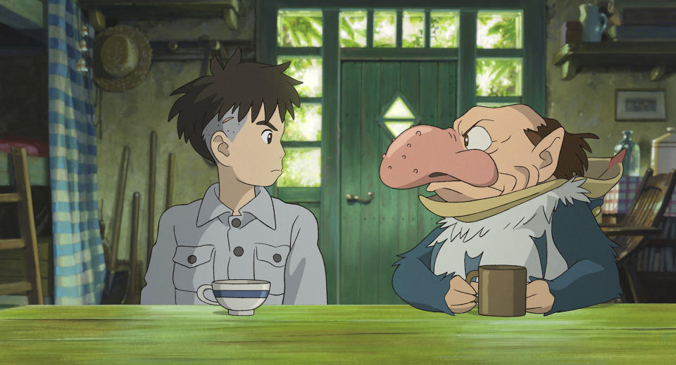 This image released by GKIDS shows Mahito Maki, voiced by Luca Padovan in English and Soma Santoki in Japanese, left, and Grey Heron, voiced by Robert Pattinson in English and Masaki Suda in Japanese, in a scene from Hayao Miyazaki's "The Boy And The Heron." (Studio Ghibli/GKIDS via AP)