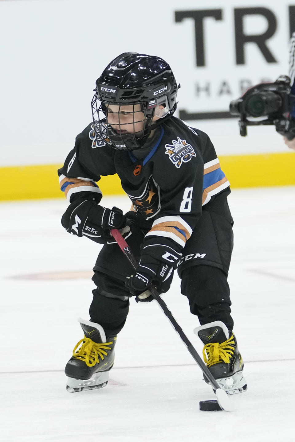 Sergei Ovechkin, 4, son of Washington Capitals' Alex Ovechkin, aims a shot on goal, during the NHL All Star Skills Showcase, Friday, Feb. 3, 2023, in Sunrise, Fla. (AP Photo/Lynne Sladky)