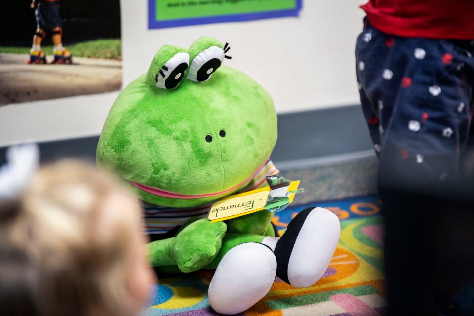 Fernando the frog sits with the children during circle time to teach the children how to sit and listen. When asked, "What does Fernando the frog do?" The children said "nothing" at St. Mary Villa Child Development Center in Nashville, Tenn., Monday, Sept. 25, 2023.