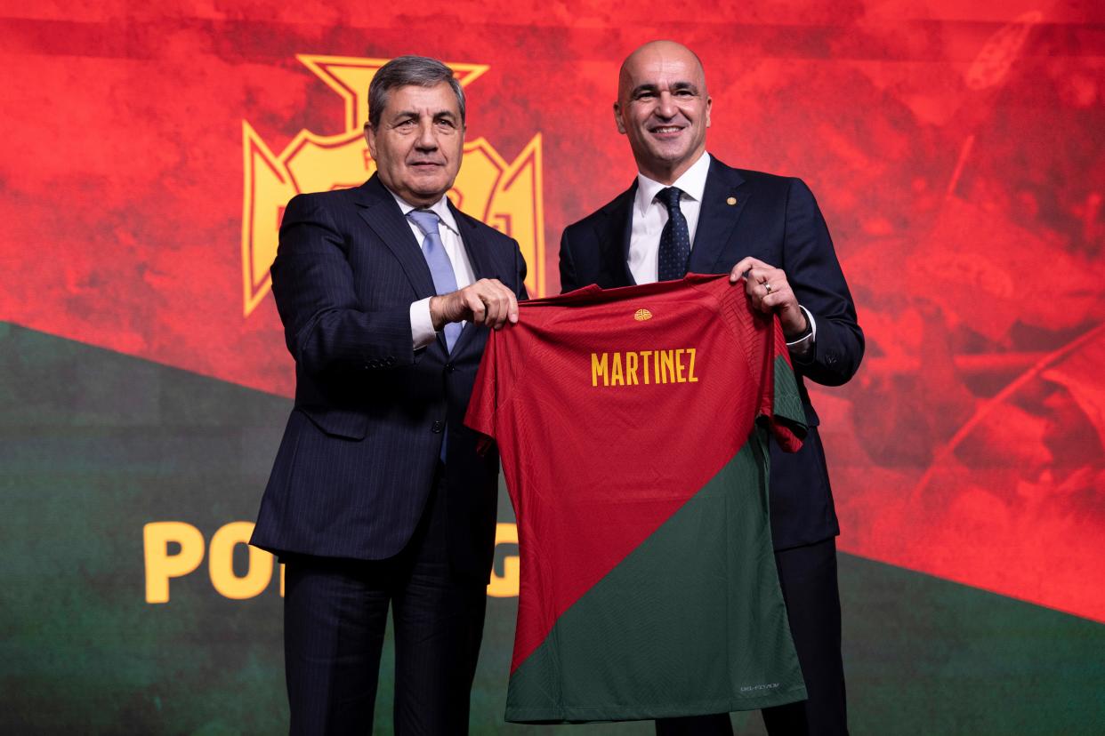 Coach Roberto Martinez, right, poses with Portuguese Soccer Federation president Fernando Gomes after being presented as Portugal's national soccer team new coach at the federation headquarters in Oeiras, outside Lisbon, Monday, Jan. 9, 2023. (AP Photo/Ana Brigida)