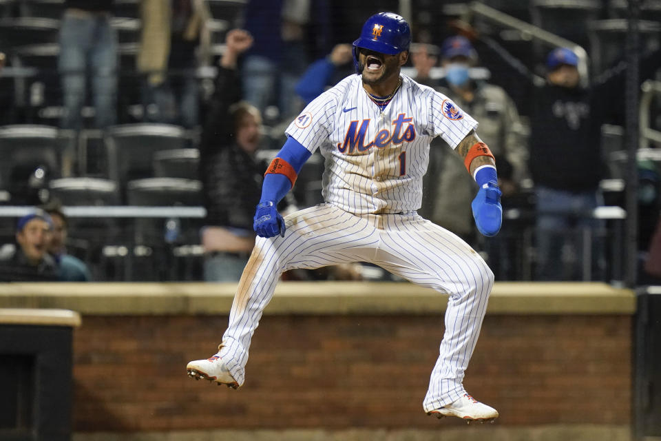 New York Mets' Jonathan Villar celebrates after scoring during the ninth inning of the team's baseball game against the Baltimore Orioles on Tuesday, May 11, 2021, in New York. The Mets won 3-2. (AP Photo/Frank Franklin II)