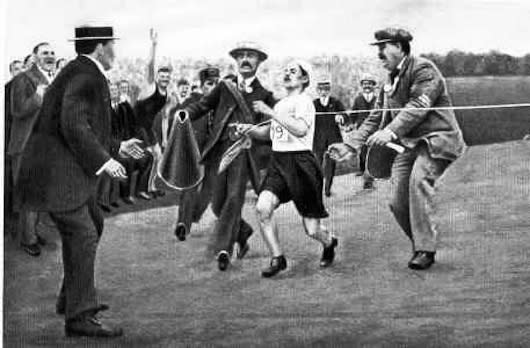 <div class="caption-credit"> Photo by: Wikimedia Commons</div><p> Near the end of marathon of the 1908 London Games, South African prison officer Charles Hefferon, leading the pack, accepted a glass of champagne from a fan. The bubbly caused him to vomit, allowing Italian pastry chef Dorando Pietri to take the lead. Pietri entered the stadium so discombobulated that he began running the wrong way, and had to be redirected by officials. He collapsed four times in the last 200 yards and required assistance to cross the line. He was proclaimed the winner, but was then disqualified for the help he received, giving American Johnny Hayes the gold and bubbly-drinker Hefferon the silver. <br> <br> <b>Related: <a rel="nofollow noopener" href="http://www.mnn.com/health/fitness-well-being/stories/why-more-marathon-runners-dont-get-hurt-infographic" target="_blank" data-ylk="slk:Why more marathon runners don't get hurt;elm:context_link;itc:0;sec:content-canvas" class="link ">Why more marathon runners don't get hurt</a></b> </p>