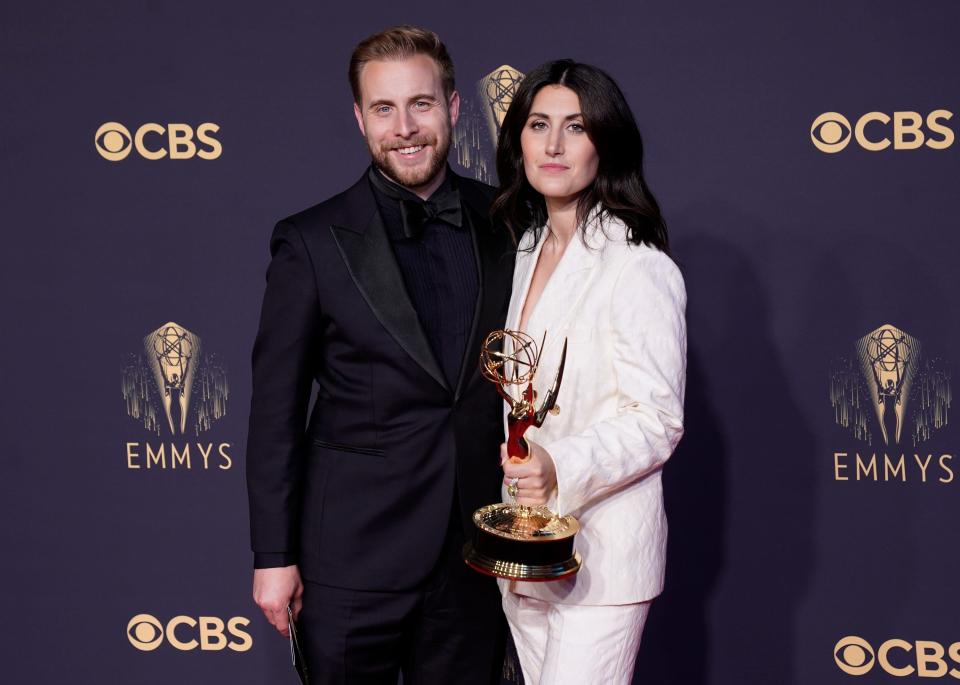 Travis Helwig, left, and Milton native Jen Statsky pose with the award for outstanding writing for a comedy series for "Hacks" at the 73rd Primetime Emmy Awards on Sunday, Sept. 19, 2021, at L.A. Live in Los Angeles.