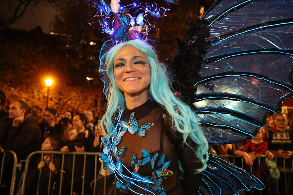 A reveler wearing a butterfly costume marches during Halloween Parade in New York City. (Photo: Gordon Donovan/Yahoo News)