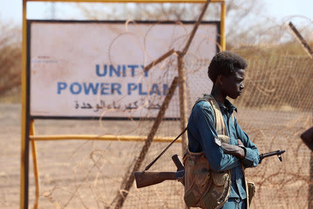 An armed South Sudanese policeman is seen during a ceremony marking the restarting of crude oil pumping at the Unity oil fields in South Sudan, January 21, 2019. REUTERS/Samir Bol