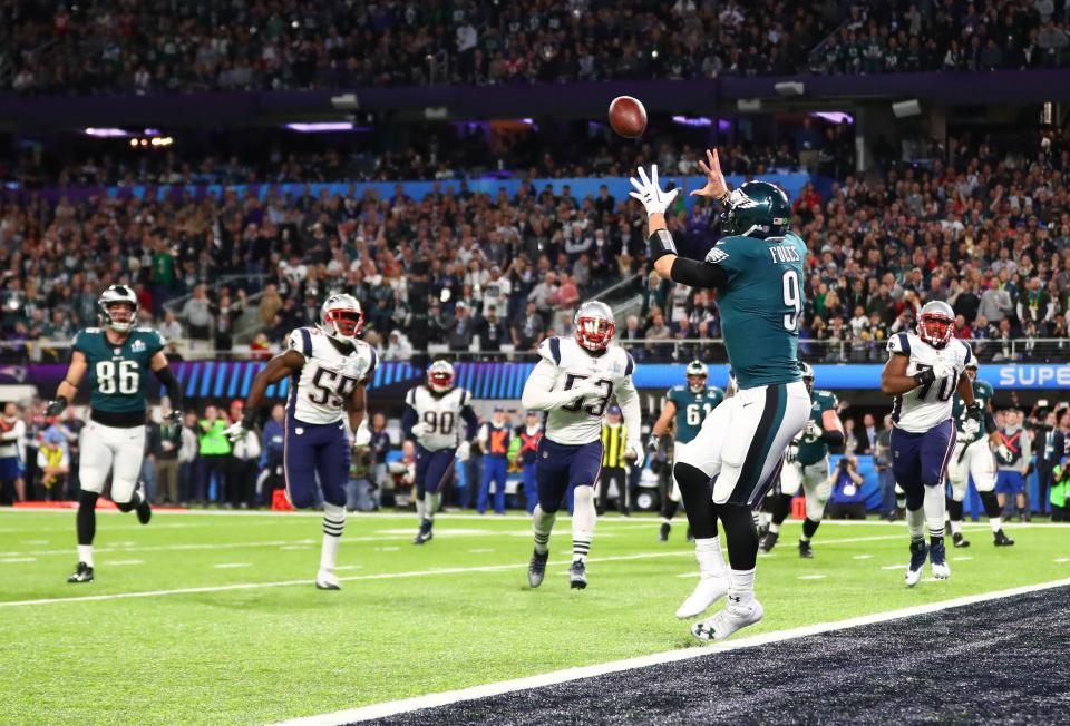 Nick Foles scores a touchdown on the "Philly Special" play in the Philadelphia Eagles' win over the New England Patriots in Super Bowl LII.