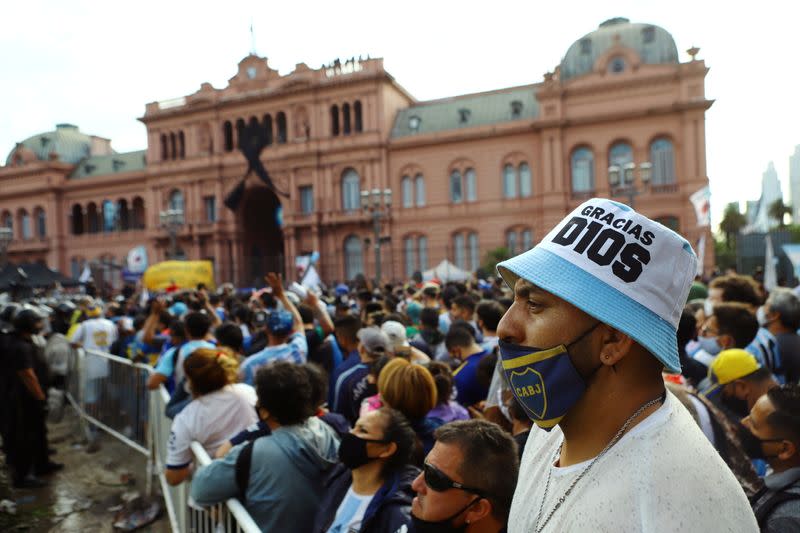 People line up for the wake of soccer legend Diego Maradona at the presidential palace Casa Rosada, in Buenos Aires