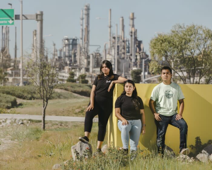 WILMINGTON, CALIFORNIA, NOV. 13, 2021: (L to R) Ashley Hernandez, 28, Communities For a Better Environment (CBE) community organizer and resident, Wendy Miranda, 25, CBE Wilmington community intern and resident, and Luis Martinez, 24, CBE climate and resiliency intern and resident, pose for a portrait on Saturday, Nov. 13, 2021, at the Wilmington Waterfront Park in Wilmington, Calif. Wilmington, neighborhood with a large Latinx and foreign-born population, is also home to robust shiping and oil industry, and the third-largest oil field in the continental United States. Communities For a Better Environment is part of the STAND-LA Coalition and together they plan and organize to urge the Los Angeles City Council to pass a city-wide oil drilling phase-out motion. (Photo / Silvia Razgova)