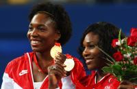 <p>Venus Williams (L) and Serena Williams of the United States celebrate the gold medal after defeating Virginia Ruano Pascual and Anabel Medina Garrigues of Spain in the Women’s Doubles gold medal match held at the Olympic Green Tennis Center during Day 9 of the Beijing 2008 Olympic Games on August 17, 2008 in Beijing, China. The Williams sisters won the gold medal. (Photo by Clive Brunskill/Getty Images) </p>