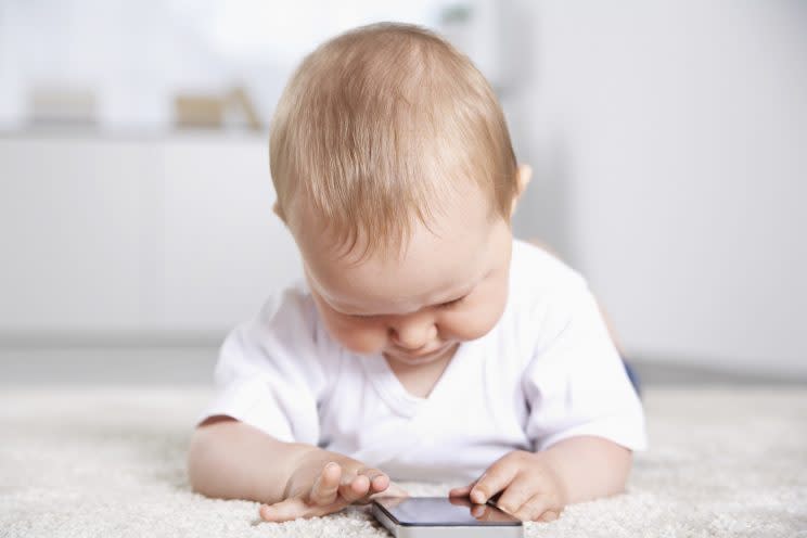 'Just updating my Instagram, mum!' More babies than ever are being set up with their own social media profiles. [Photo: Getty]