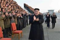 North Korean leader Kim Jong Un visits participants of a national agriculture competition in this undated photo released by North Korea's Korean Central News Agency (KCNA) February 10, 2014. REUTERS/KCNA